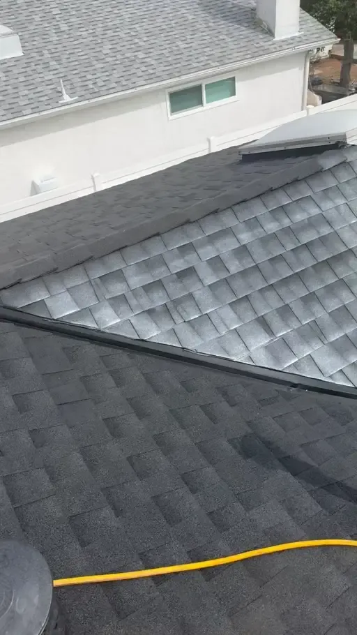 Aerial view of treated asphalt shingles after Relife rejuvenation